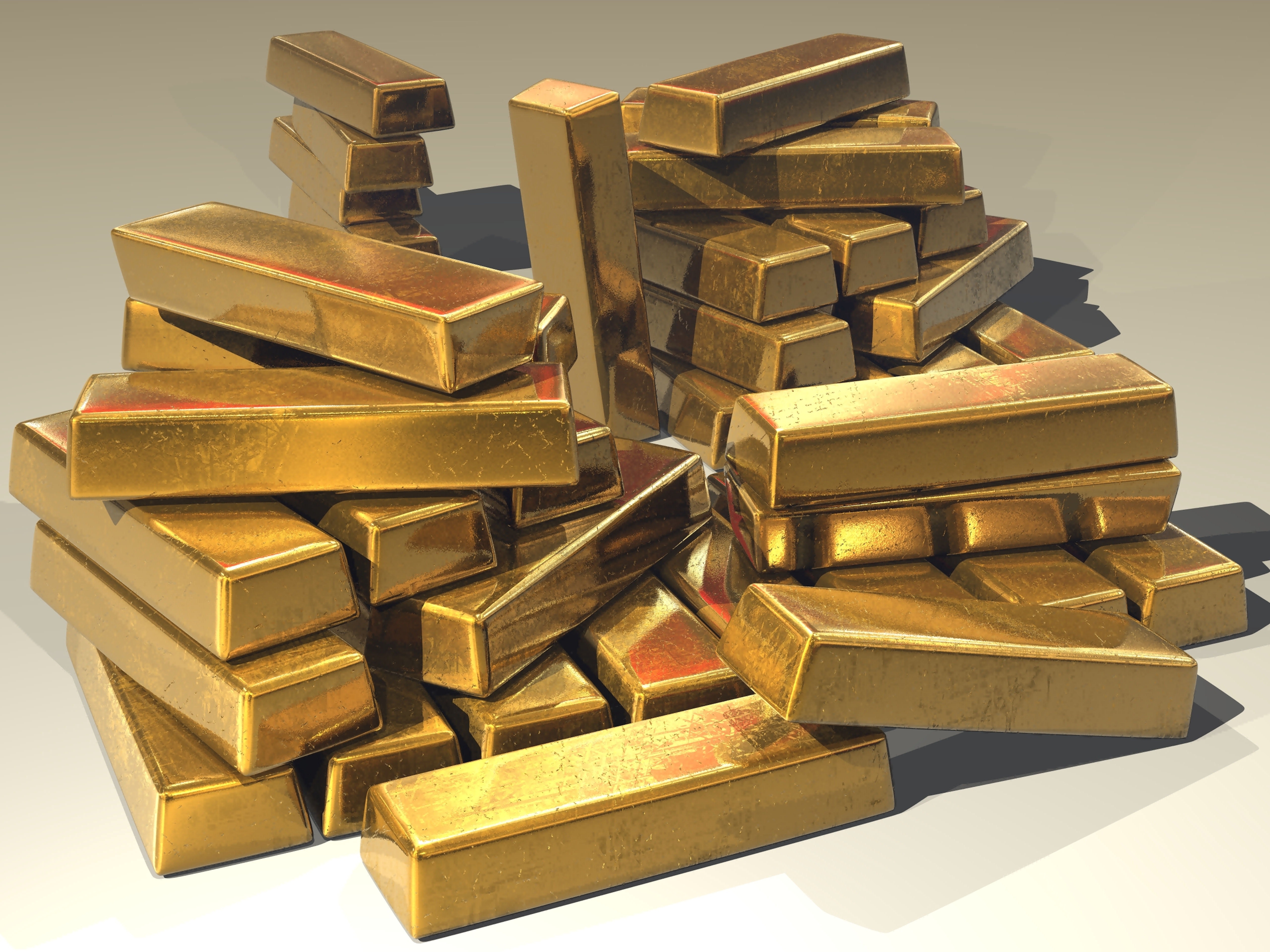 Gestapelte Goldbarren, das Metall, an dem der Nisab für die Zakat gemessen wird